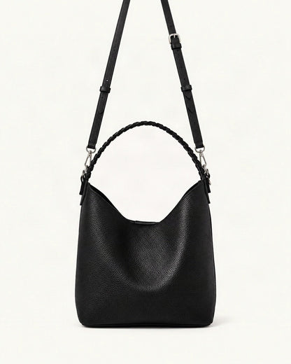 Cowhide Leather Bucket Bag Braided Handle — straight-on front view on a warm white background