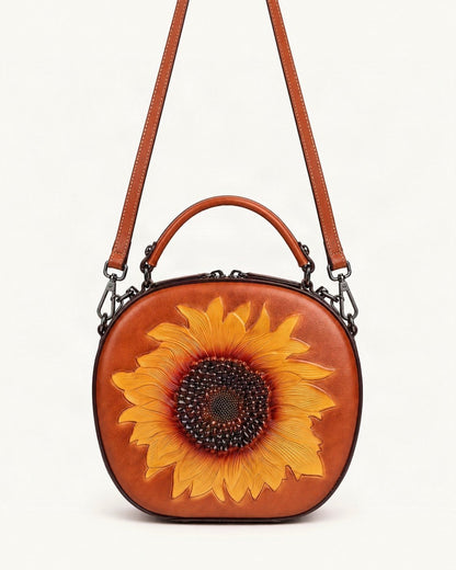 Top-Grain Cowhide Round Crossbody Bag — straight-on front view on a warm white background