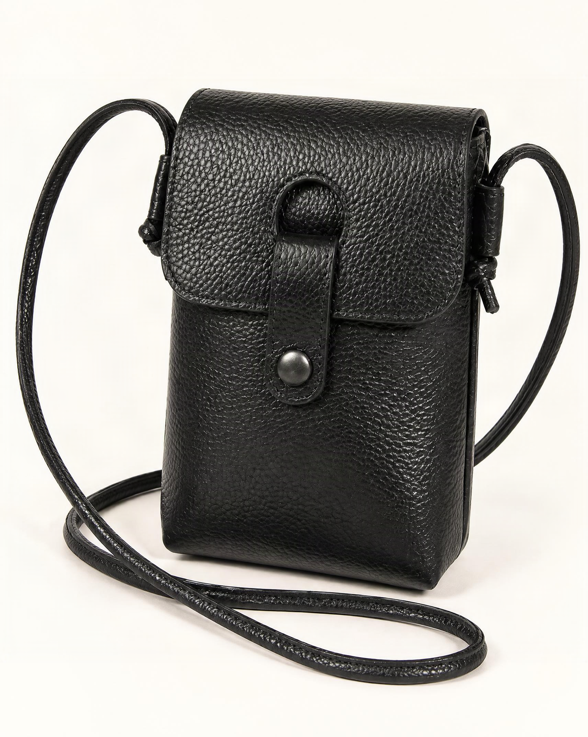 Pebbled Cowhide Micro Crossbody Phone Bag — front three-quarter view on a warm white background