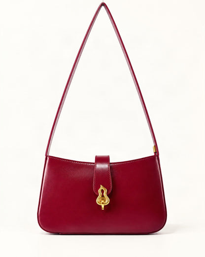 Cowhide Leather Small Shoulder Bag with Gourd Lock Clasp — straight-on front view on a warm white background