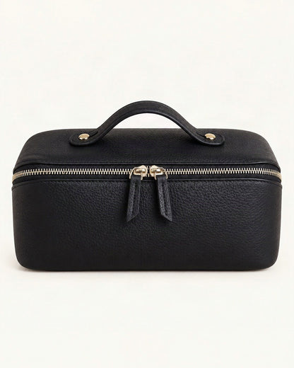 Top-Grain Cowhide Cosmetic Pouch with Double Zippers — straight-on front view on a warm white background