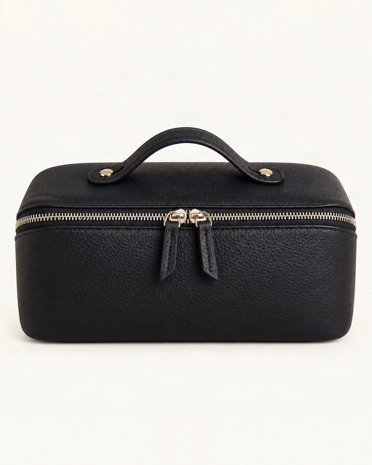 Top-Grain Cowhide Cosmetic Pouch with Double Zippers — straight-on front view on a warm white background