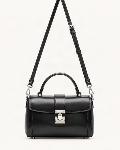 Cowhide Leather Mini Box Crossbody Bag with Lock Clasp — straight-on front view on a warm white background