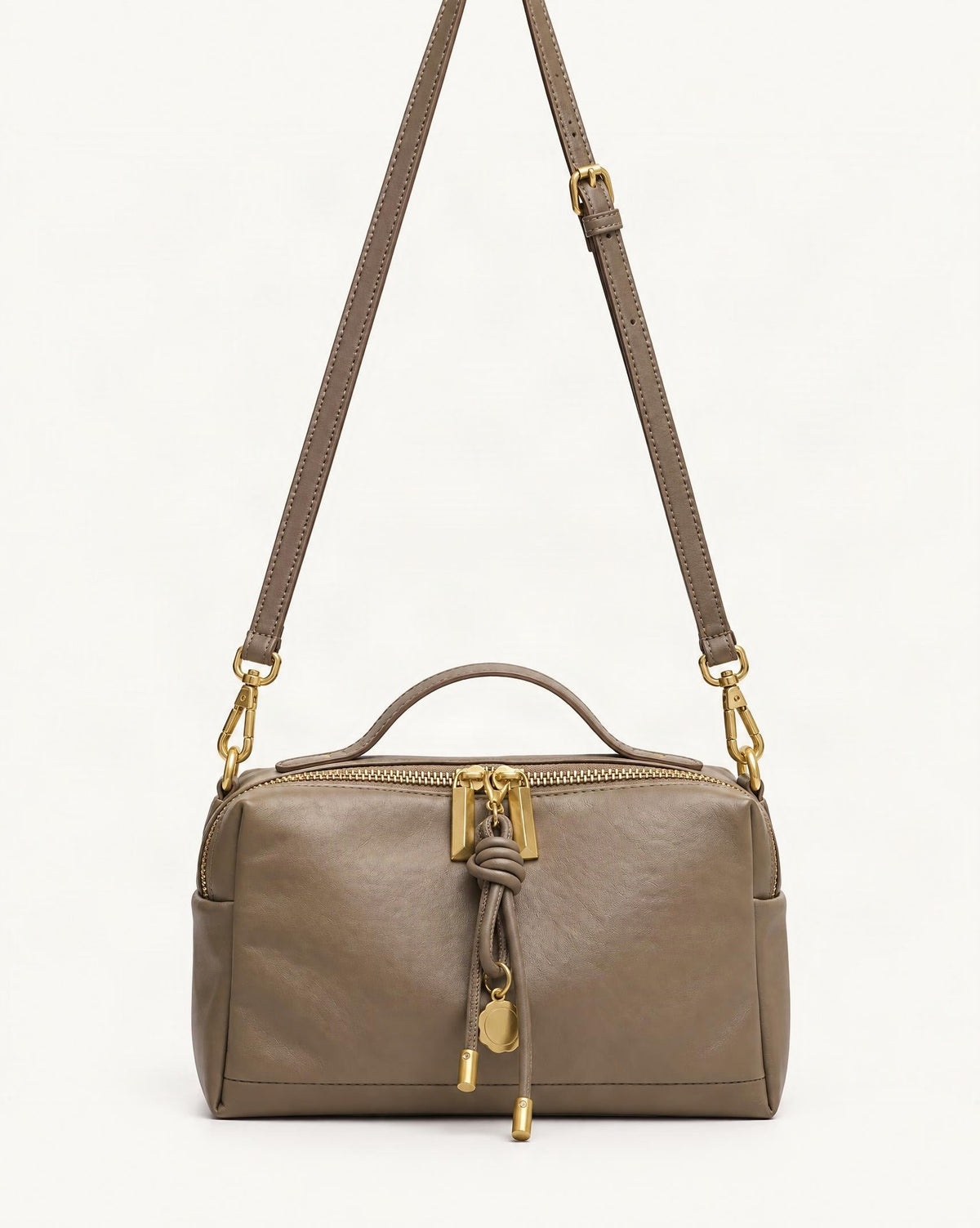 Cowhide Leather Small Crossbody Bag — straight-on front view on a warm white background