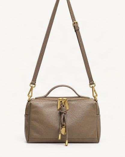 Cowhide Leather Small Crossbody Bag — straight-on front view on a warm white background