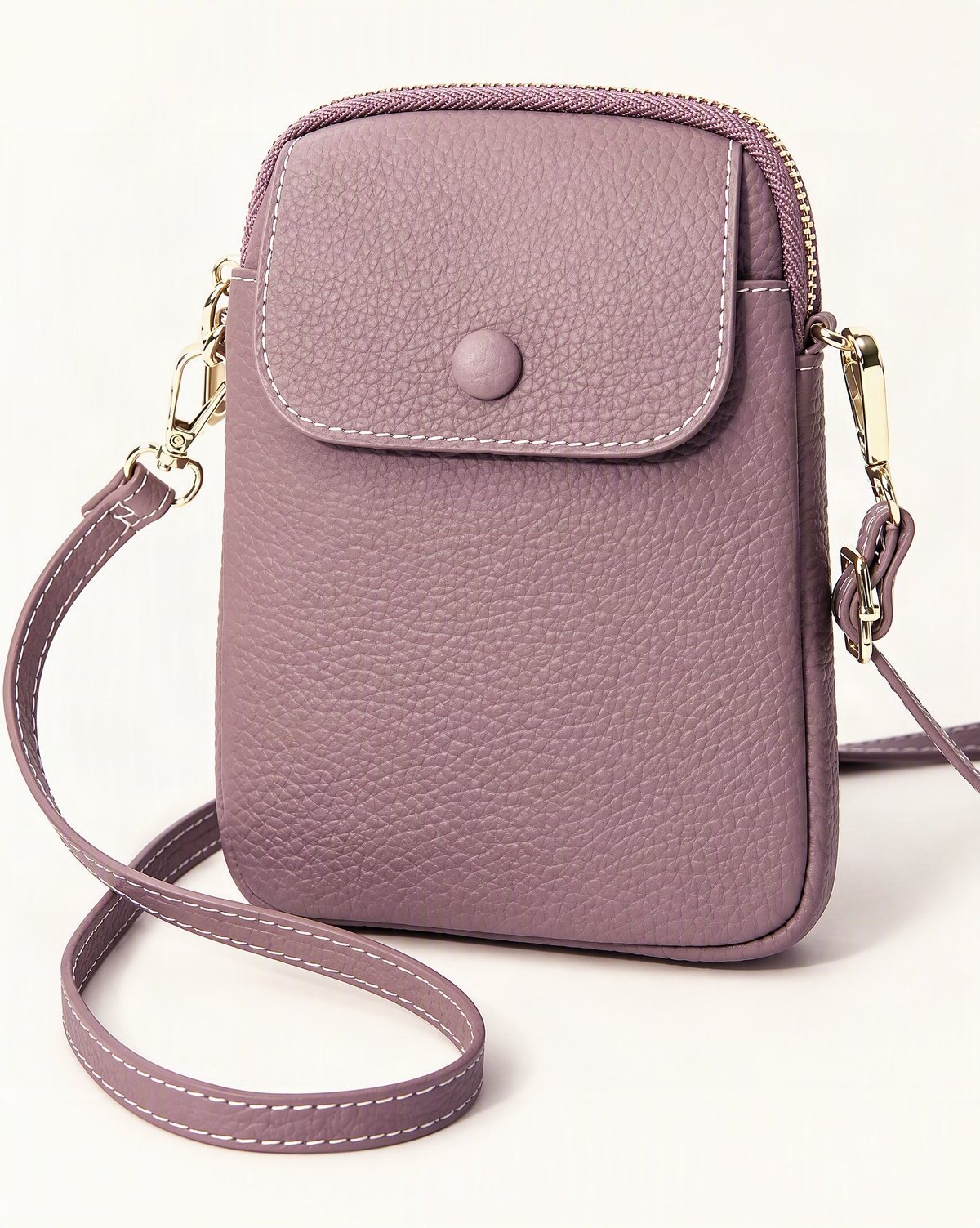 Top-Grain Cowhide Leather Micro Crossbody Phone Bag — front three-quarter view on a warm white background