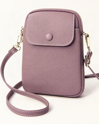 Top-Grain Cowhide Leather Micro Crossbody Phone Bag — front three-quarter view on a warm white background