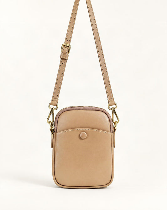 Cowhide Leather Micro Crossbody Bag with Adjustable Strap — straight-on front view on a warm white background