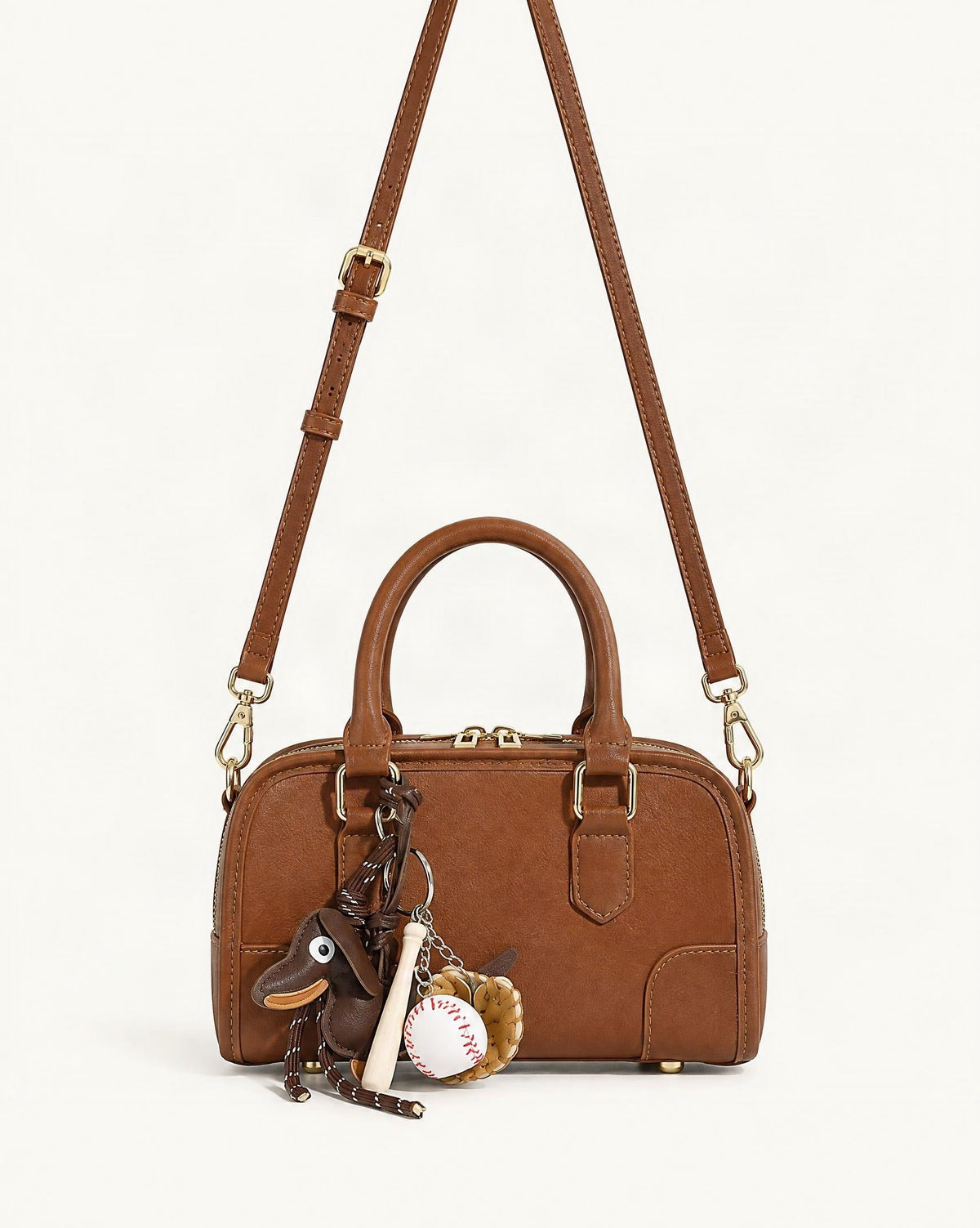 Split Leather Small Bowling Bag — straight-on front view on a warm white background
