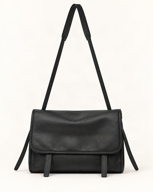 Cowhide Leather Messenger Crossbody Bag — straight-on front view on a warm white background