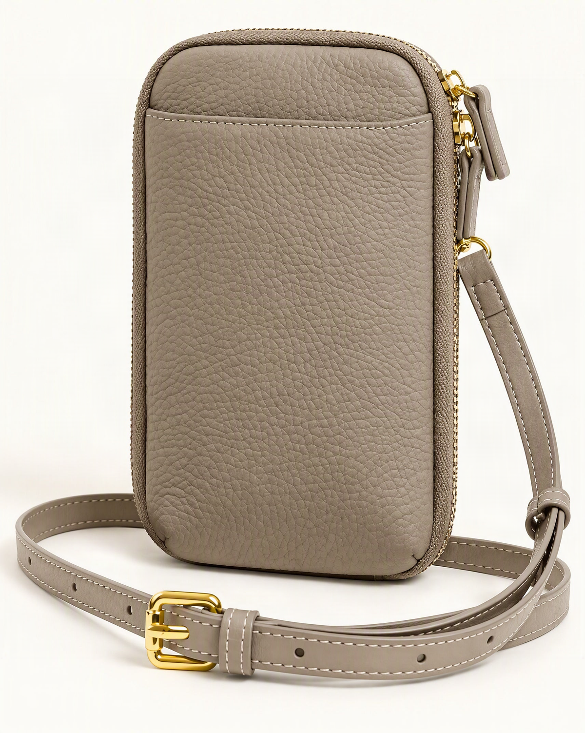 Cowhide Leather Micro Crossbody Phone Bag — front three-quarter view on a warm white background