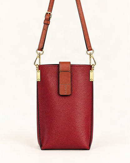 Cowhide Micro Crossbody Phone Bag — straight-on front view on a warm white background