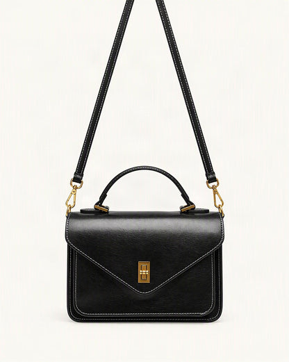 Cowhide Leather Small Messenger Crossbody Bag — straight-on front view on a warm white background