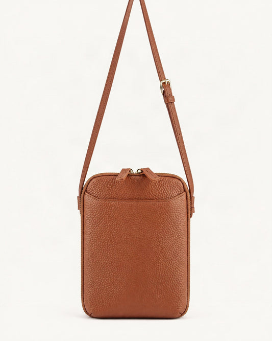 Cowhide Vertical Crossbody Phone Bag, Pebbled — straight-on front view on a warm white background