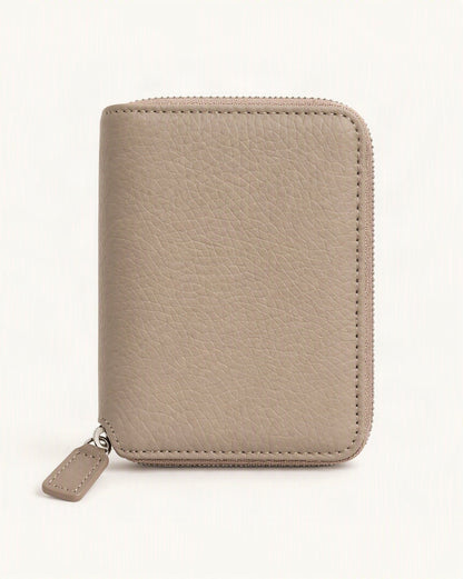 Cowhide Leather Compact Bi-Fold Wallet — straight-on front view on a warm white background