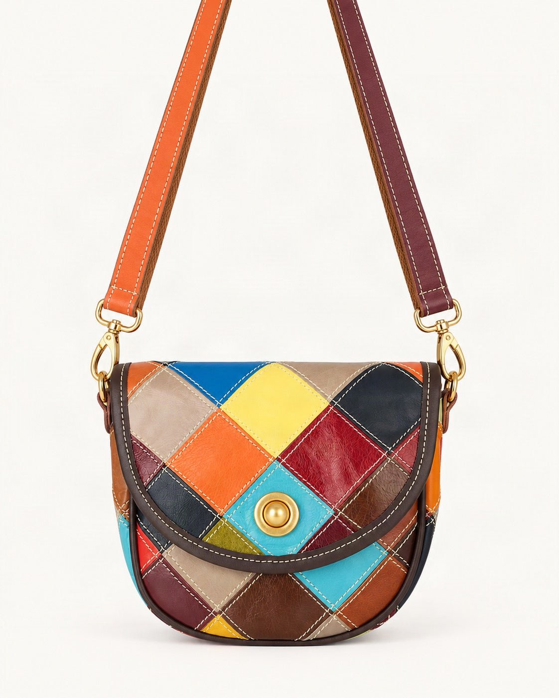 Cowhide Patchwork Crossbody Bag — straight-on front view on a warm white background