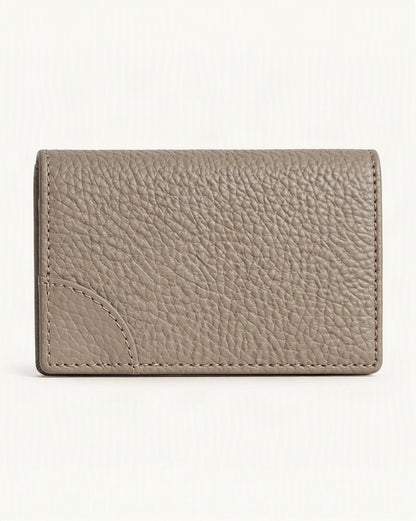 Cowhide Leather Mini Bifold Card Holder Wallet — straight-on front view on a warm white background