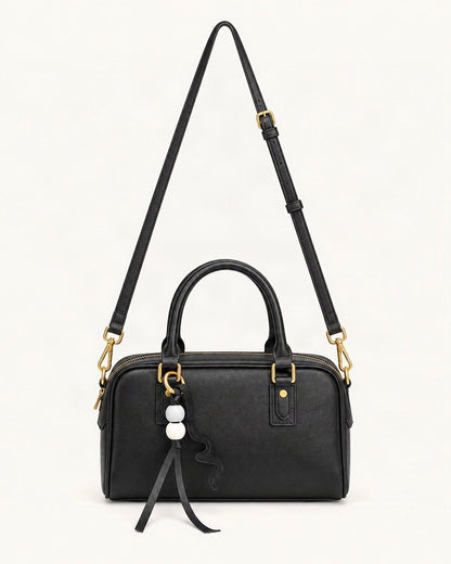 Cowhide Leather Double-Handle Pillow Crossbody Bag — straight-on front view on a warm white background