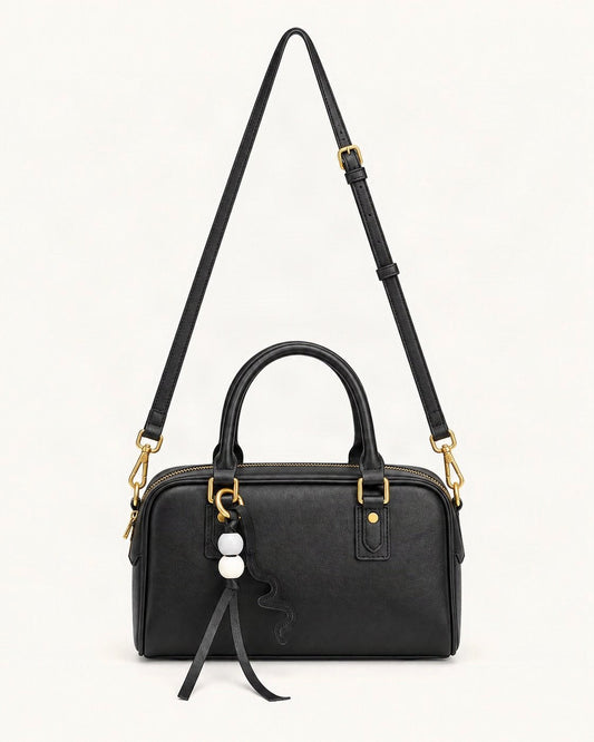 Cowhide Leather Double-Handle Pillow Crossbody Bag — straight-on front view on a warm white background