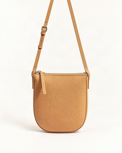 Cowhide Leather Mini Crossbody Phone Bag — straight-on front view on a warm white background