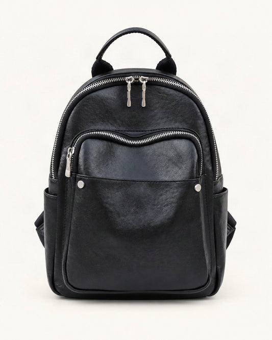 Top-Grain Cowhide Small Backpack — straight-on front view on a warm white background