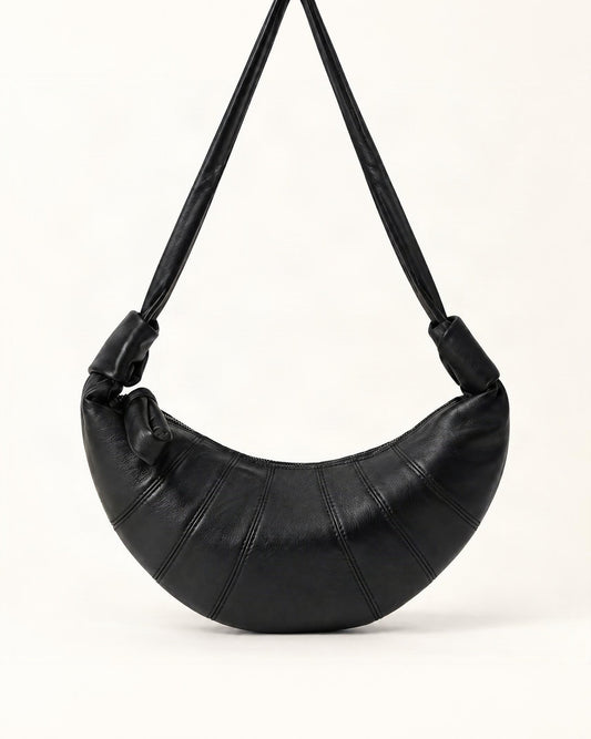 Lambskin Crescent Crossbody Bag with Knotted Strap — straight-on front view on a warm white background