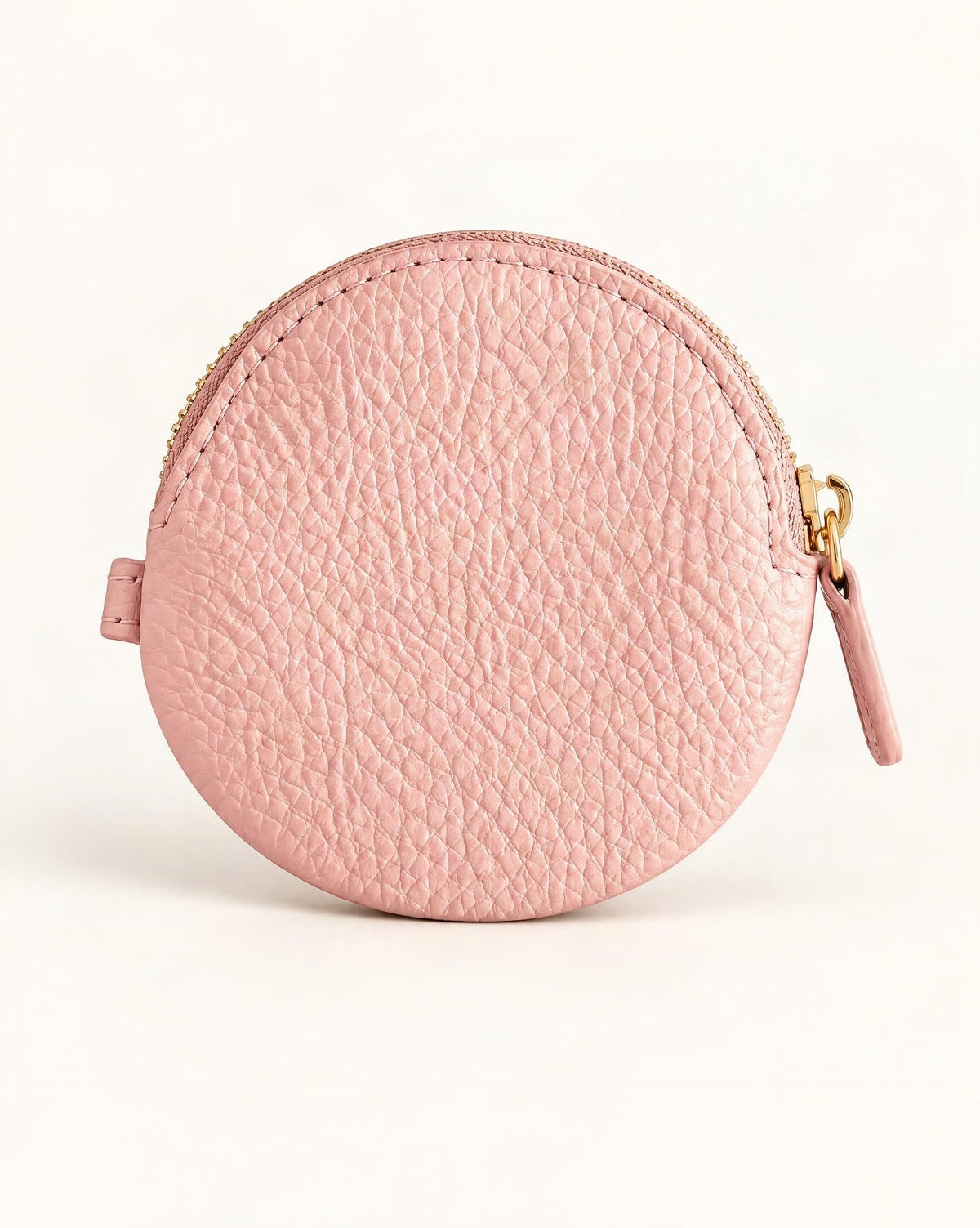 Cowhide Leather Mini Round Zip Pouch — straight-on front view on a warm white background