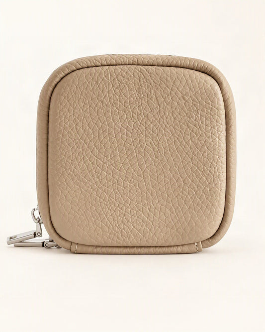 Pebbled Leather Mini Cosmetic Pouch — straight-on front view on a warm white background
