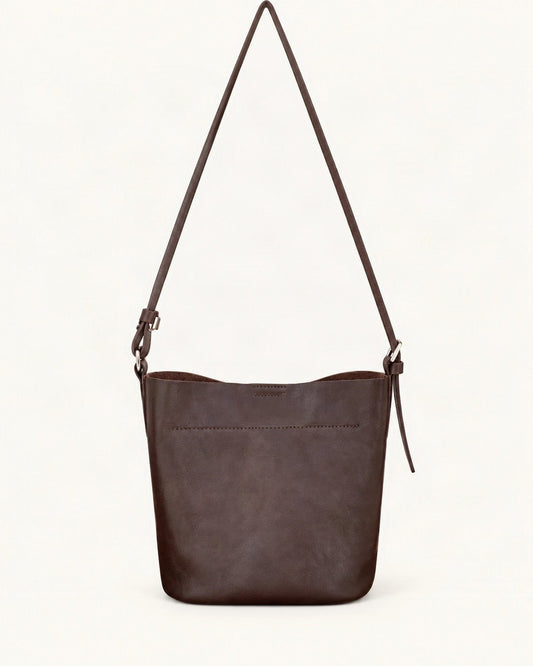 Top-Grain Cowhide Mini Bucket Shoulder Bag — straight-on front view on a warm white background
