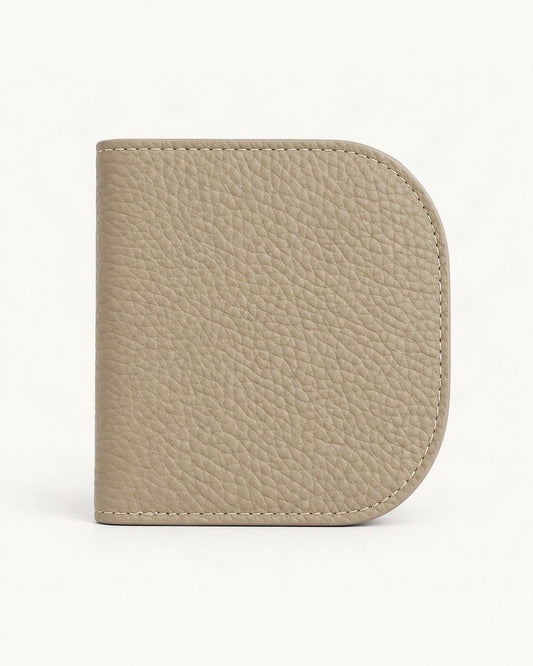 Cowhide Leather Compact Bifold Wallet — straight-on front view on a warm white background