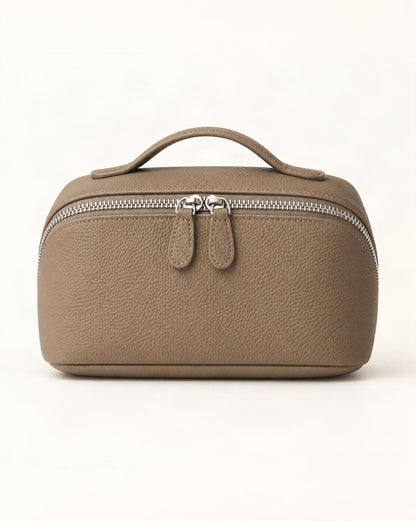 Cowhide Leather Travel Pouch with Top Handle — straight-on front view on a warm white background