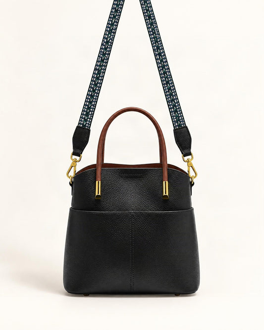 Cowhide Leather Bucket Bag with Woven Strap — straight-on front view on a warm white background