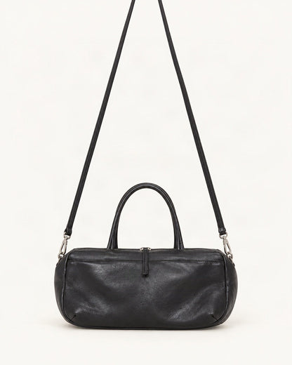 Lambskin Small Boston Bag — straight-on front view on a warm white background