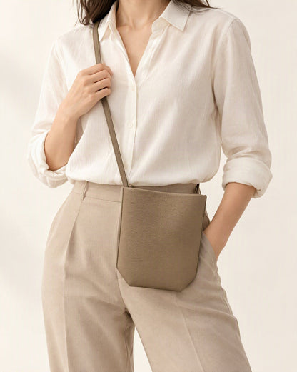 Top-Grain Cowhide Mini Bucket Crossbody Bag – Color Options worn crossbody