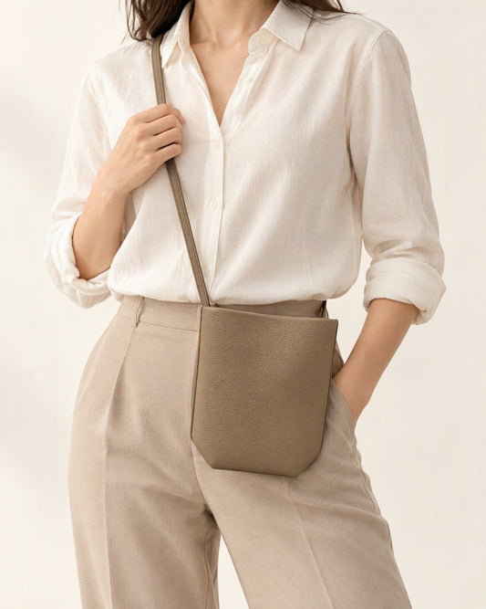 Top-Grain Cowhide Mini Bucket Crossbody Bag – Color Options worn crossbody