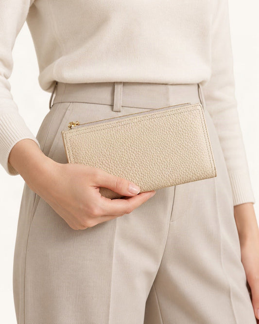 Top-Grain Cowhide Long Wallet with RFID-Blocking Lining held in hand by a model