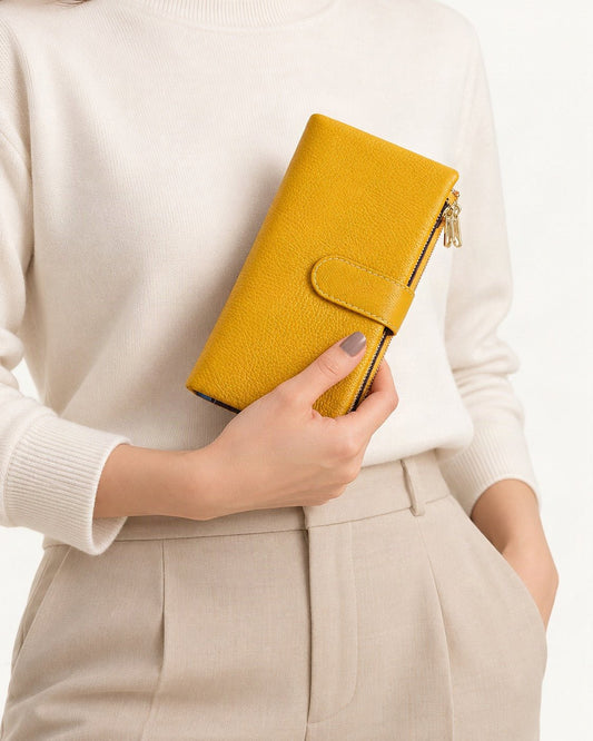 Genuine Leather Long Bifold Wallet held in hand by a model