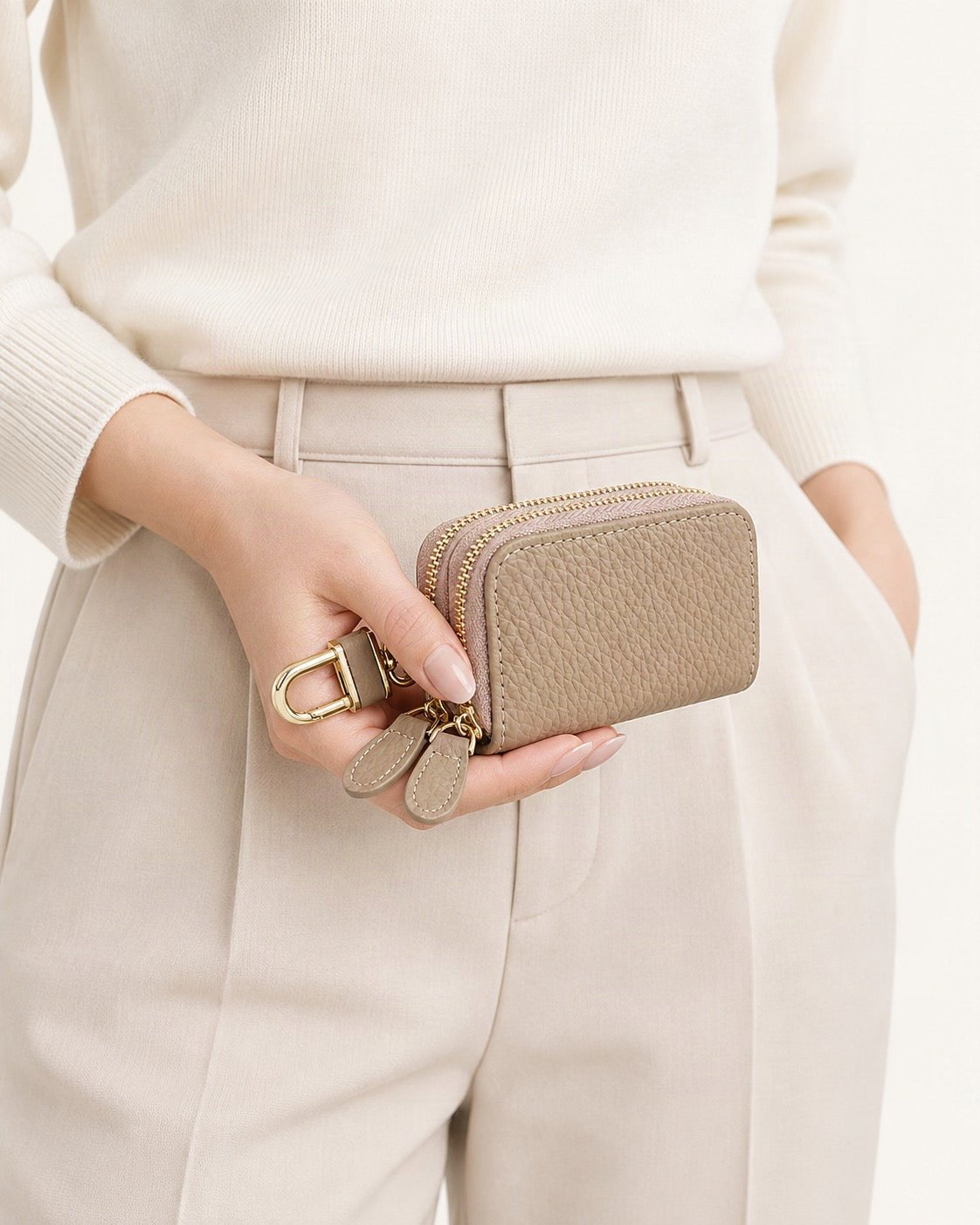 Cowhide Leather Compact Key Case with Clip held in hand by a model
