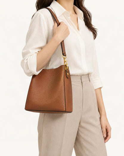 Cowhide Leather Small Bucket Tote Bag worn crossbody