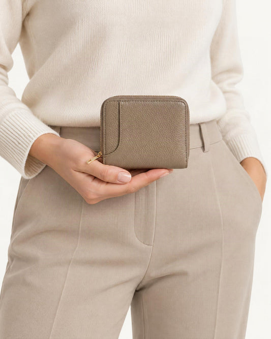 RFID-Blocking Pebbled Cowhide Wallet & Key Holder held in hand by a model