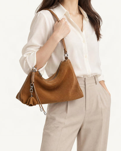 Nubuck Cowhide Underarm Tote Bag with Tassel worn crossbody