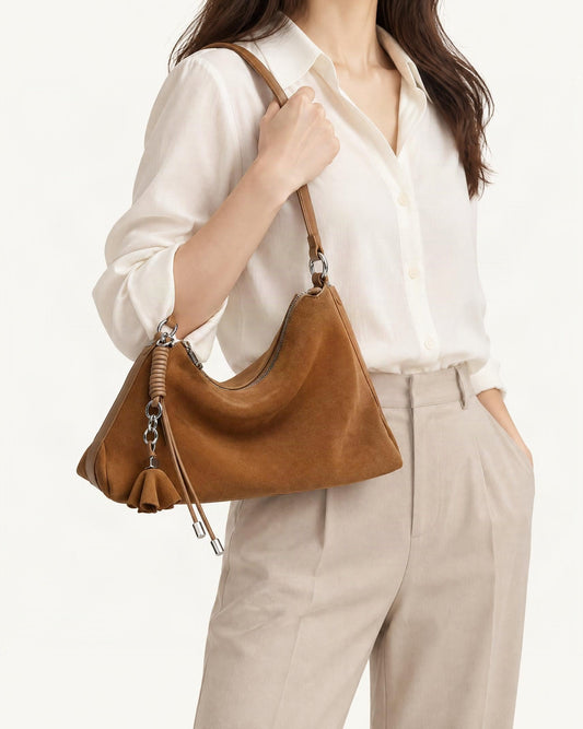Nubuck Cowhide Underarm Tote Bag with Tassel worn crossbody
