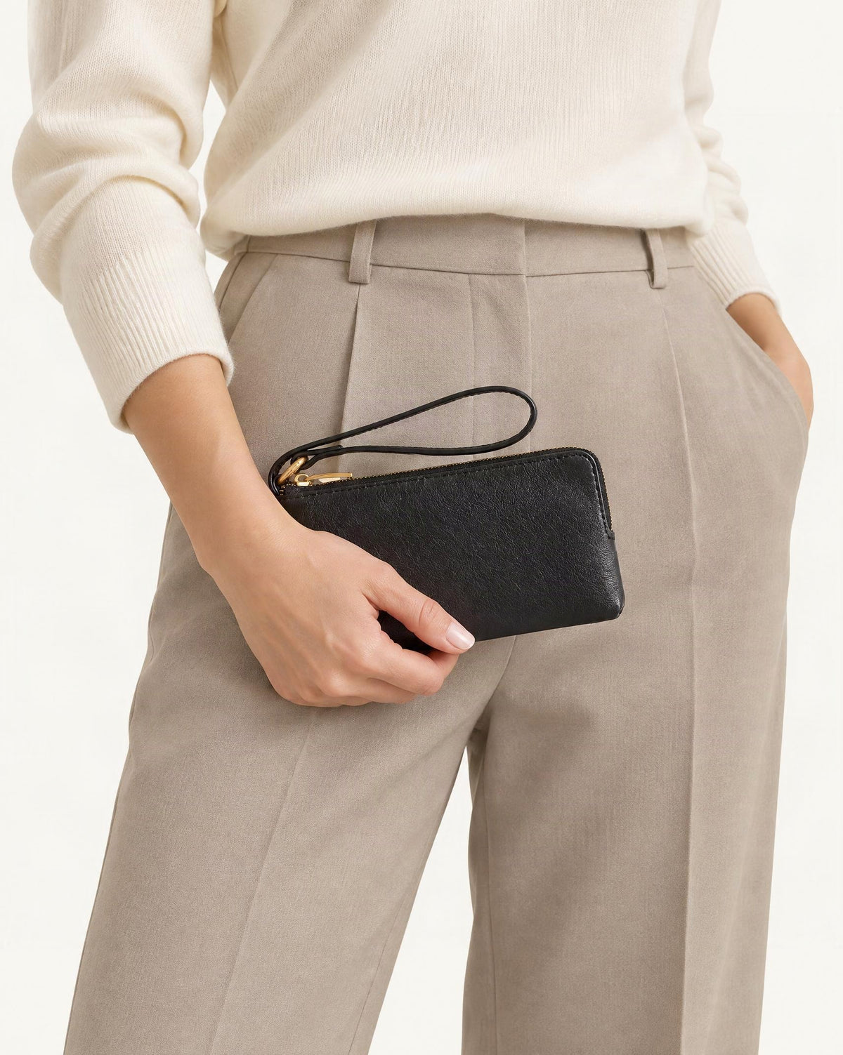 Cowhide Leather Long Wallet with Wrist Strap held in hand by a model