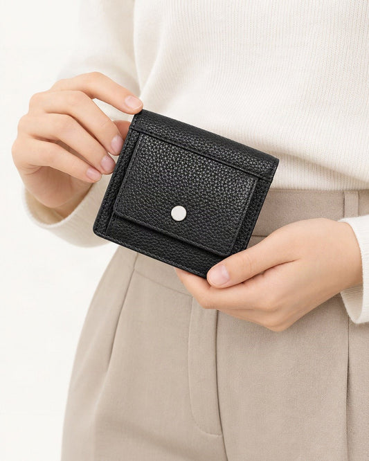 Top-Grain Cowhide Folding Wallet with Coin Pocket held in hand by a model