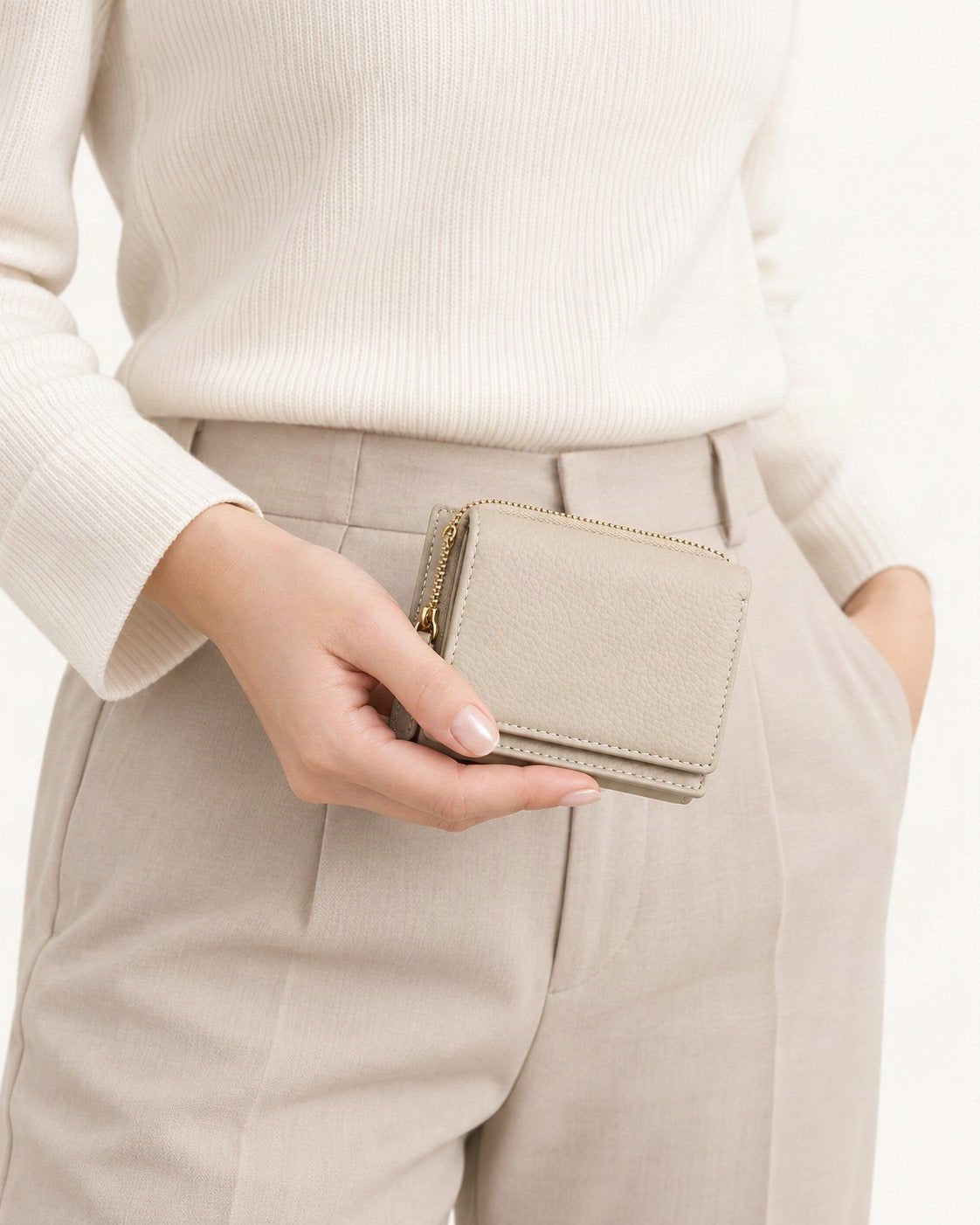 Genuine Leather RFID Small Wallet with Coin Pocket held in hand by a model