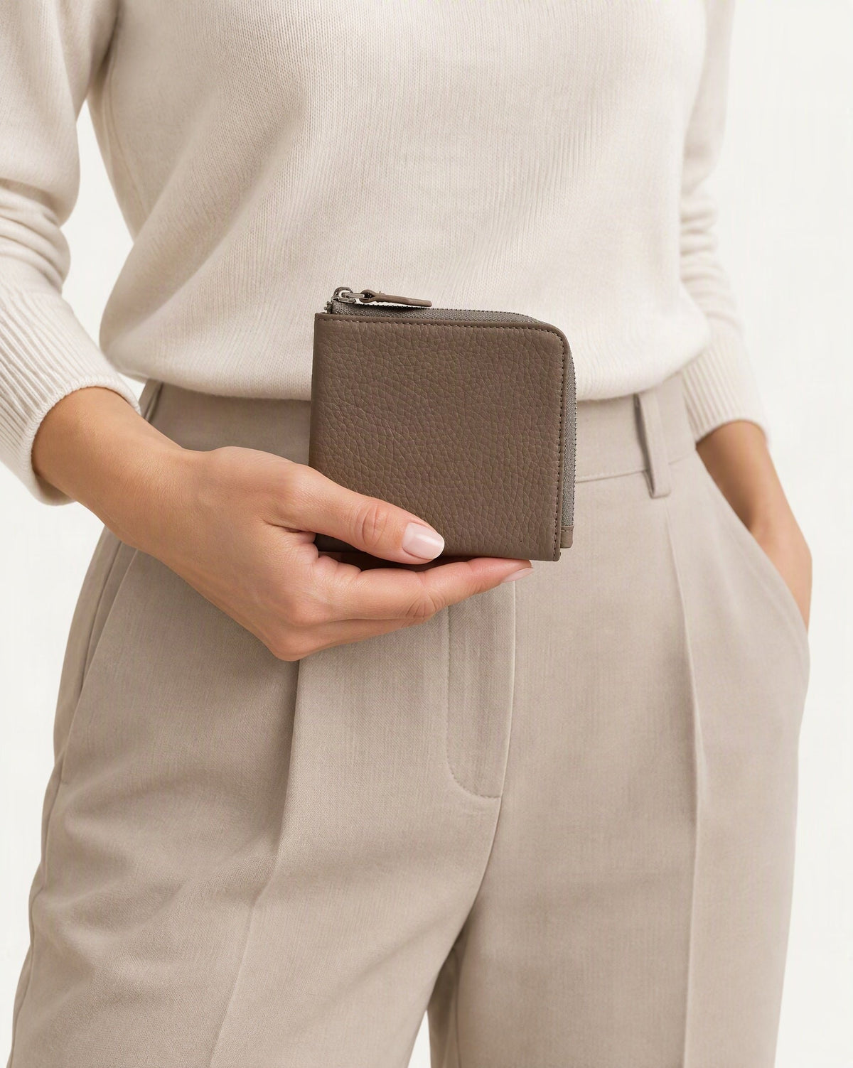 Cowhide Leather Short RFID-Blocking Wallet held in hand by a model