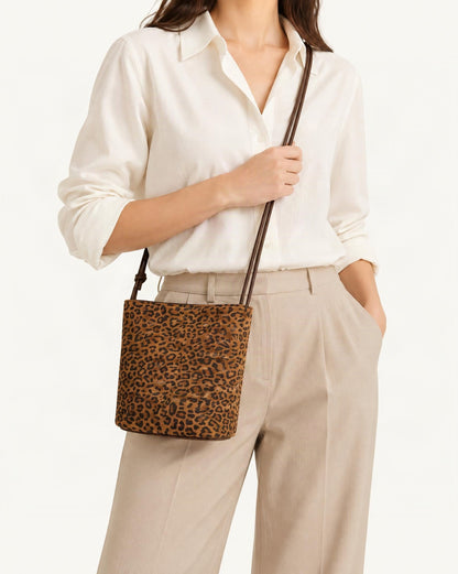Nubuck Cowhide Bucket Crossbody Bag worn crossbody