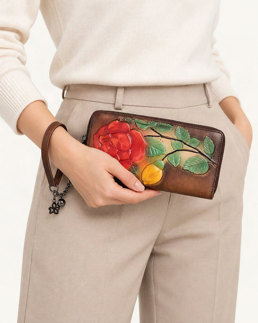 Top-Grain Cowhide Zip-Around Wallet held in hand by a model