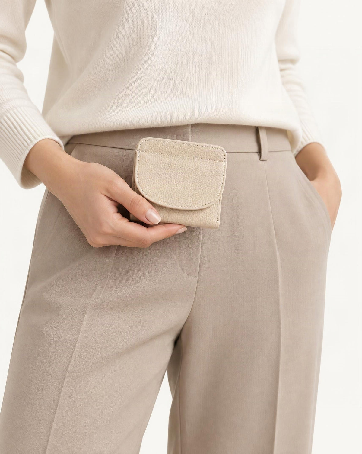Genuine Leather Bifold Wallet with 8 Card Slots held in hand by a model