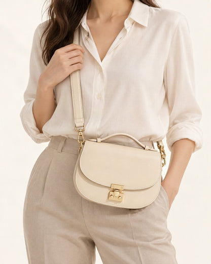 Cowhide Leather Mini Saddle Crossbody Bag with Push Lock worn crossbody